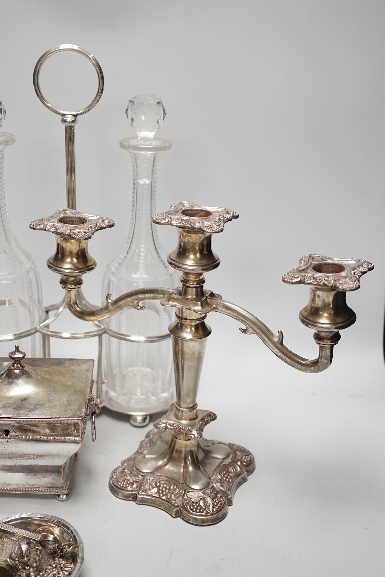 Assorted plated items including a decanter stand with two bottles, by Hukin & Heath and a tea caddy etc.